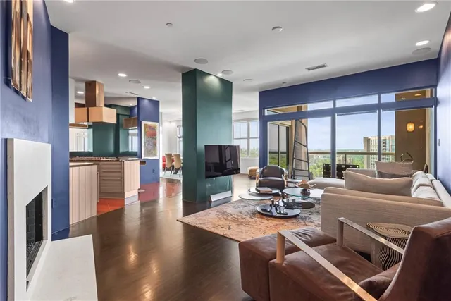 a bathroom with a granite countertop sink a mirror and shower
