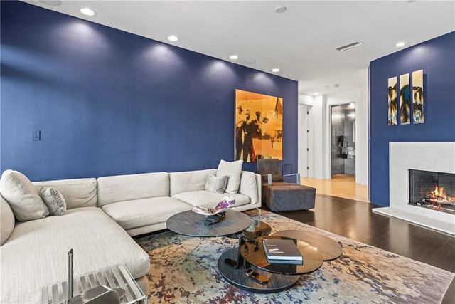 a bathroom with a granite countertop sink and a window