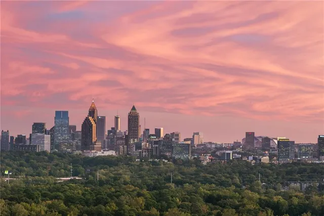 a living room filled with furniture and a large window