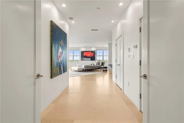 a view of a tall building next to a road