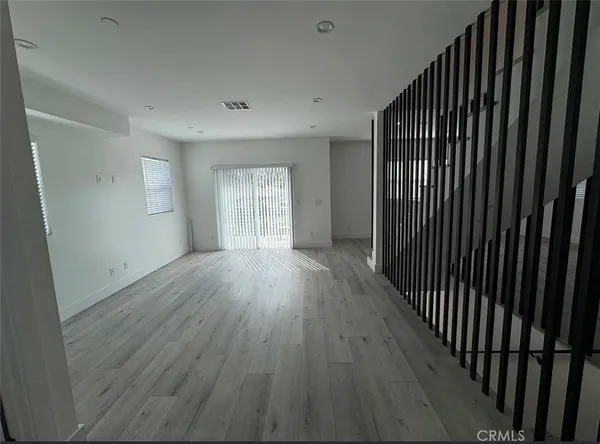 a bathroom with a sink a toilet a mirror and shower