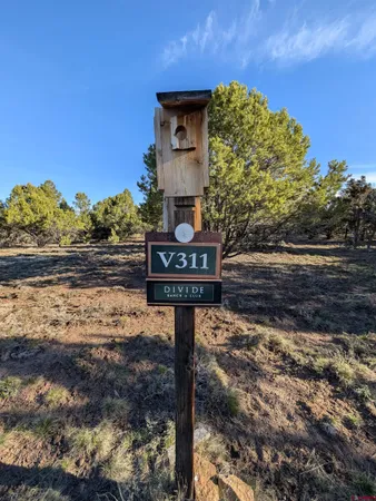 a sign board on the side of a road