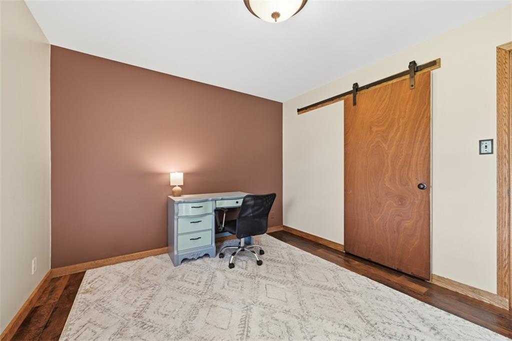 108 Connoquenessing School Road Connoquenessing, PA 16027 - Photo 17 of 50 a room that has a bed and a chair in it