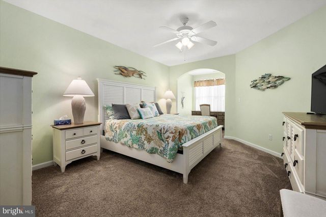 a bathroom with a sink a mirror and shower