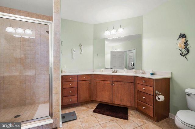 a bedroom with a bed table and a window