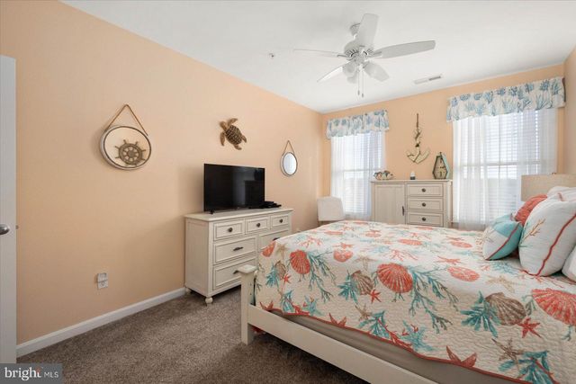 a view of a two chairs and a table in a yard
