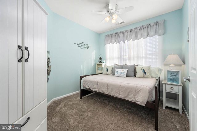 a view of swimming pool with outdoor seating and city view