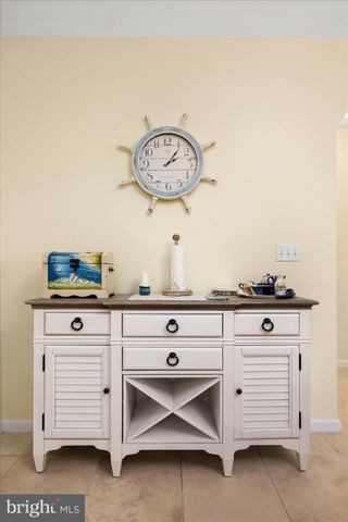 a living room with fireplace furniture and a chandelier