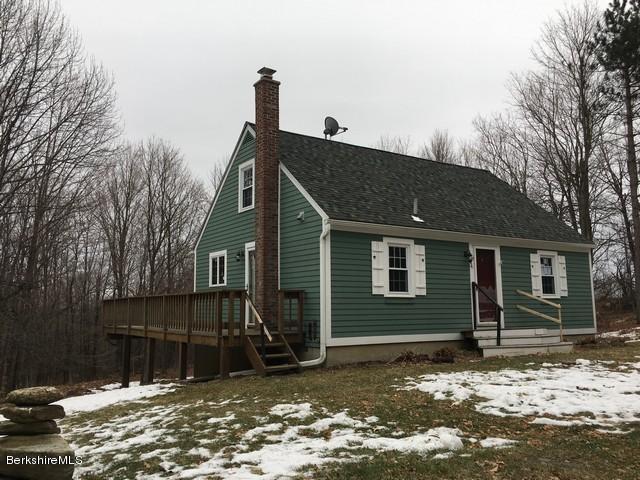 4 Bryan Road Middlefield, MA 01011 - Photo 2 of 29 a front view of a house with a yard
