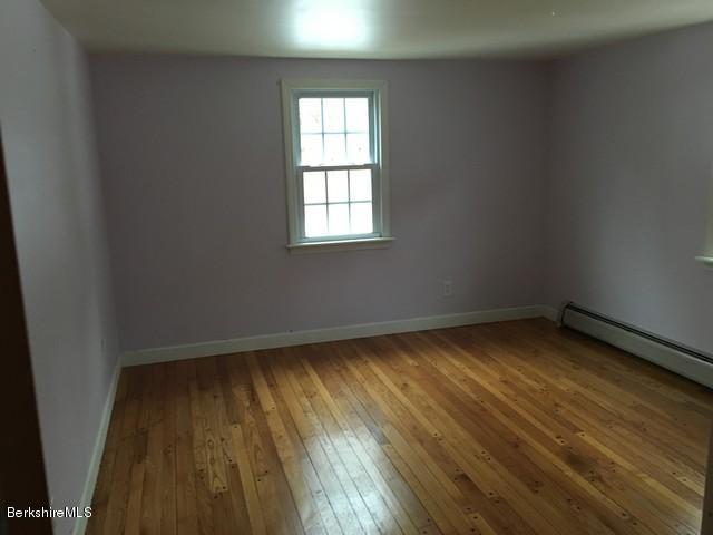 4 Bryan Road Middlefield, MA 01011 - Photo 13 of 29 an empty room with wooden floor and windows