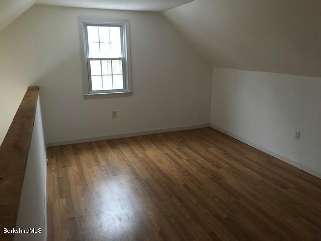 4 Bryan Road Middlefield, MA 01011 - Photo 15 of 29 an empty room with wooden floor and windows