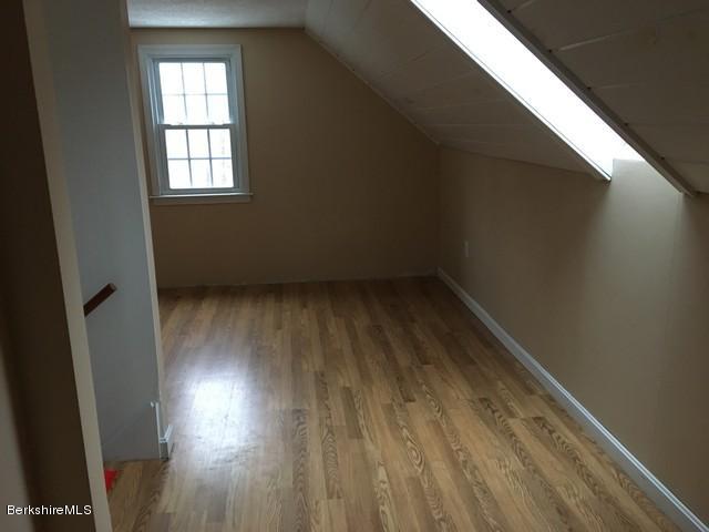 4 Bryan Road Middlefield, MA 01011 - Photo 17 of 29 an empty room with wooden floor and windows
