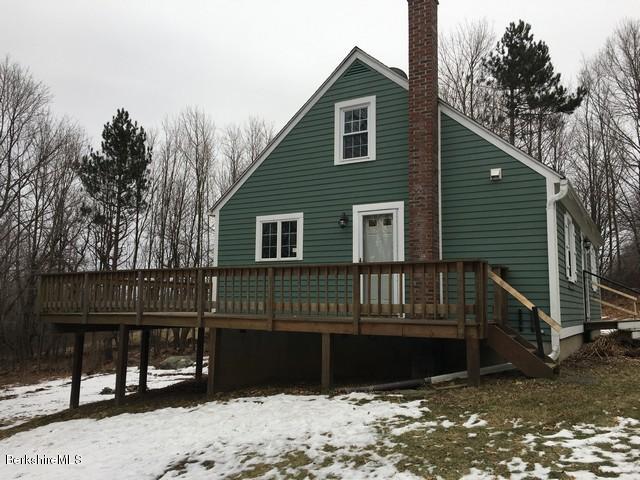 4 Bryan Road Middlefield, MA 01011 - Photo 3 of 29 a front view of a house with a balcony