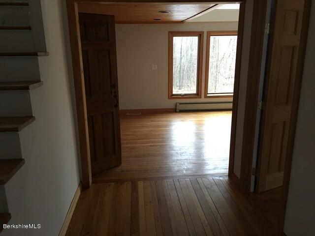 4 Bryan Road Middlefield, MA 01011 - Photo 21 of 29 a view of empty room with wooden floor and fan