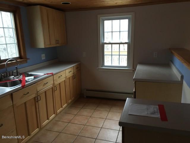 4 Bryan Road Middlefield, MA 01011 - Photo 23 of 29 a kitchen with a sink stove and cabinets