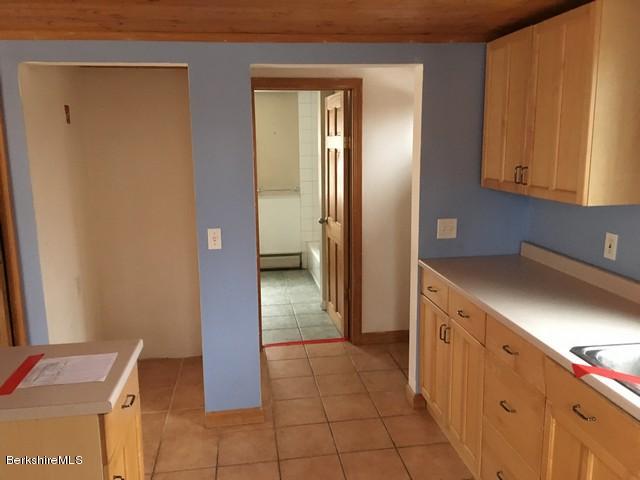 4 Bryan Road Middlefield, MA 01011 - Photo 24 of 29 a kitchen with a refrigerator and cabinets