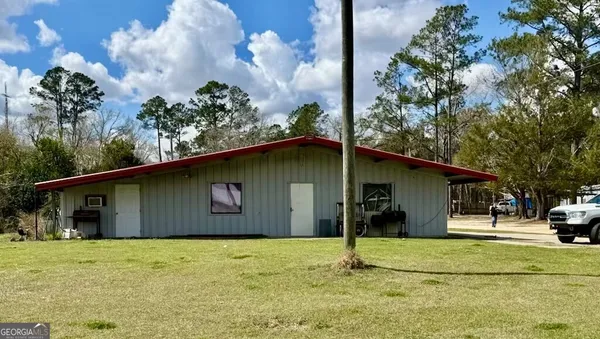 a house with trees in the background