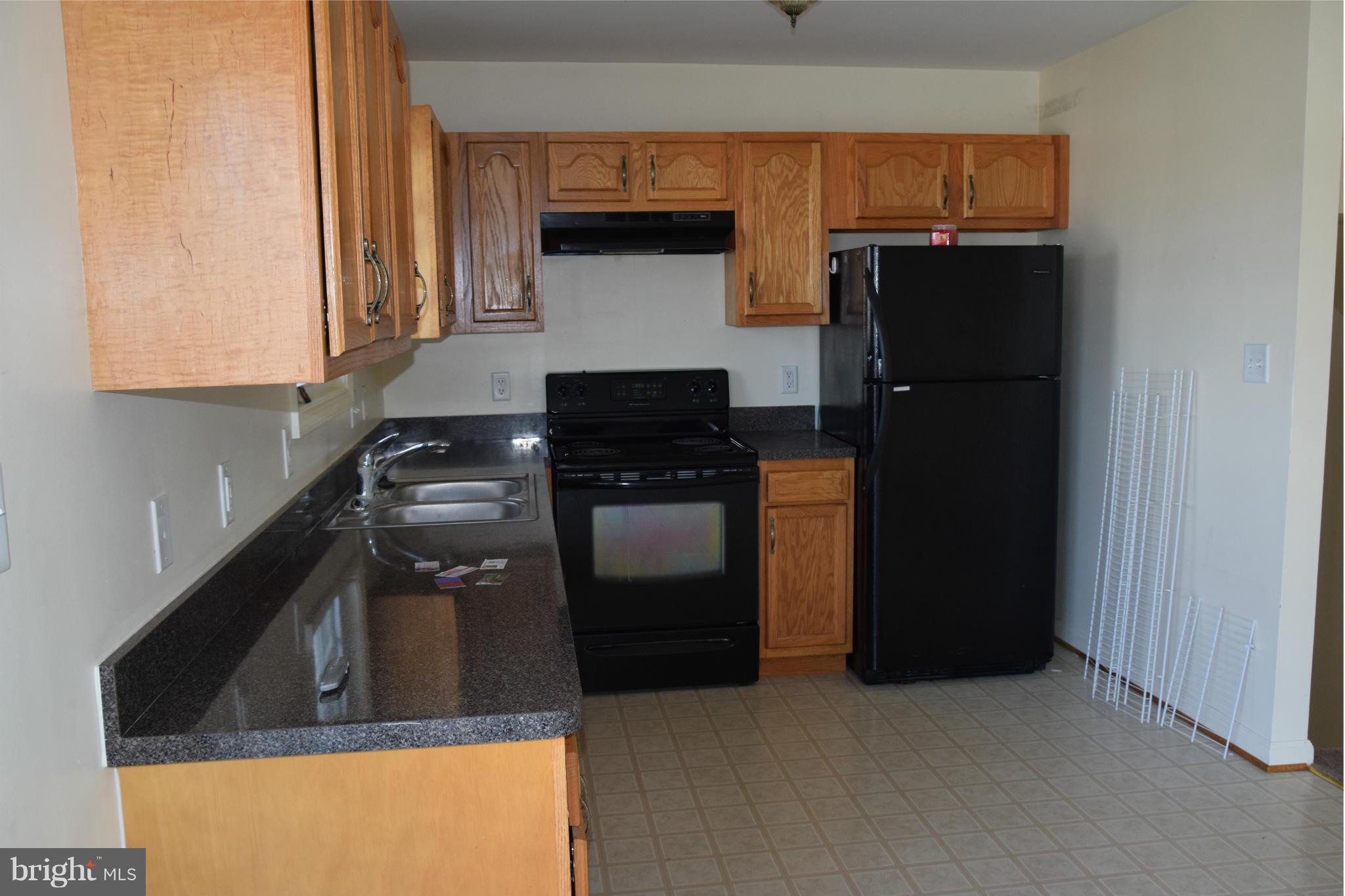 25 Fuzzy Tail Drive Ranson, WV 25438 - Photo 13 of 25 a kitchen with a stove and a refrigerator