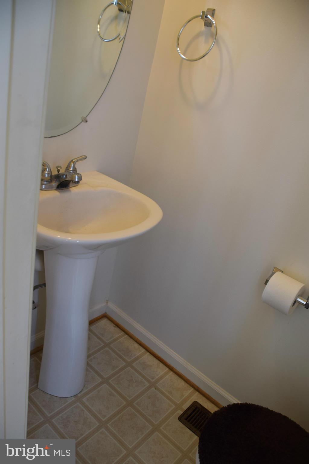 25 Fuzzy Tail Drive Ranson, WV 25438 - Photo 19 of 25 a bathroom with a sink and vanity