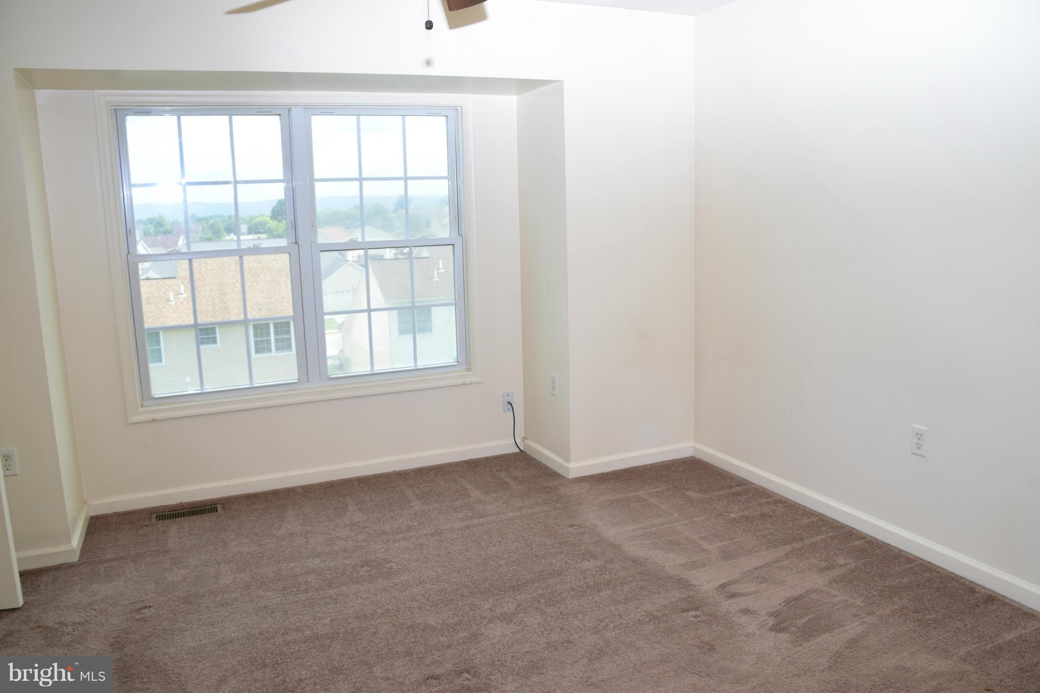 25 Fuzzy Tail Drive Ranson, WV 25438 - Photo 21 of 25 an empty room with a window