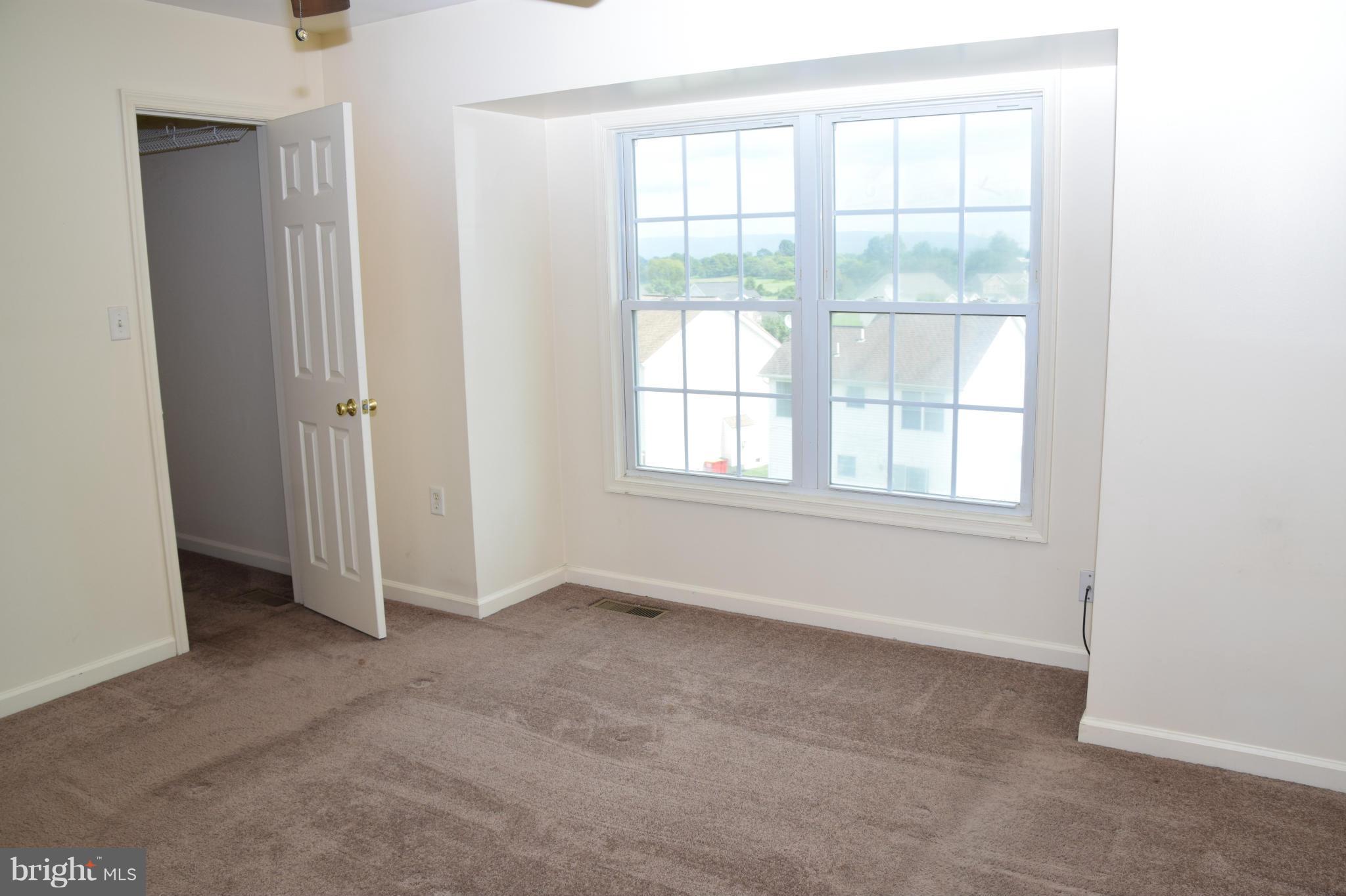 25 Fuzzy Tail Drive Ranson, WV 25438 - Photo 22 of 25 an empty room with windows