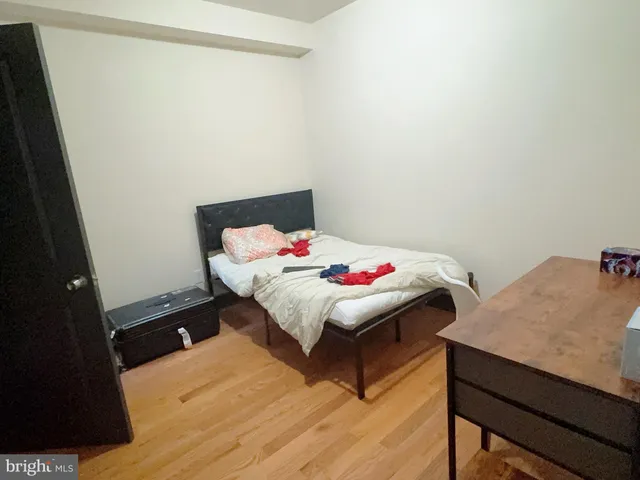 a bedroom with a bed and a table
