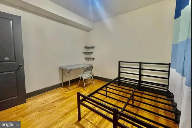 a view of a room with wooden floor and stairs