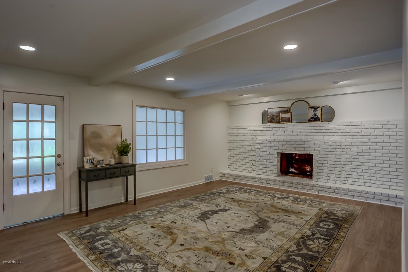 7578 Apple Valley Road Germantown, TN 38138 - Photo 16 of 22 Living room featuring beamed ceiling, a fireplace, hardwood / wood-style flooring, and plenty of natural light