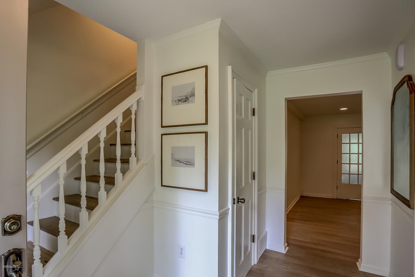 7578 Apple Valley Road Germantown, TN 38138 - Photo 21 of 22 Hallway with wood-type flooring and crown molding
