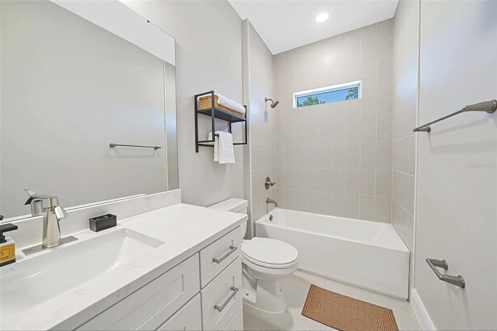 6137 Monegro Street Sebring, FL 33872 - Photo 18 of 30 a bathroom with a sink a toilet and shower