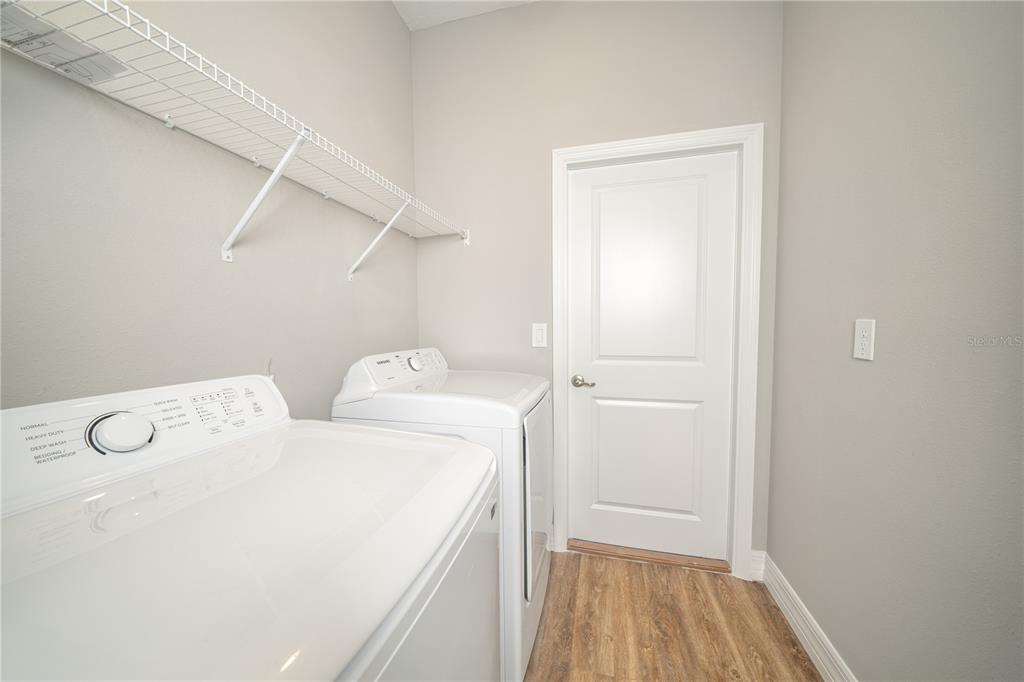 6137 Monegro Street Sebring, FL 33872 - Photo 20 of 30 a utility room with dryer and washer