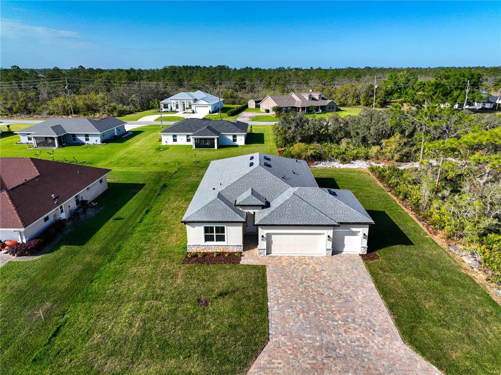 6137 Monegro Street Sebring, FL 33872 - Photo 26 of 30 an aerial view of a house with a garden