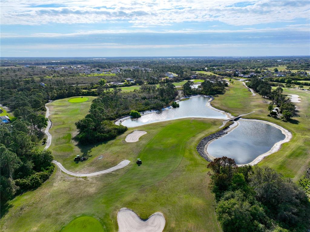 6137 Monegro Street Sebring, FL 33872 - Photo 28 of 30 an aerial view of residential houses with outdoor space and lake view