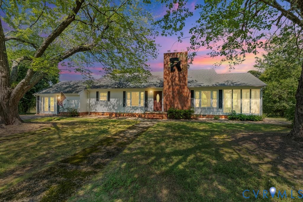 579 Stokes Road Farmville, VA 23901 - Photo 1 of 49 a front view of a house with a garden