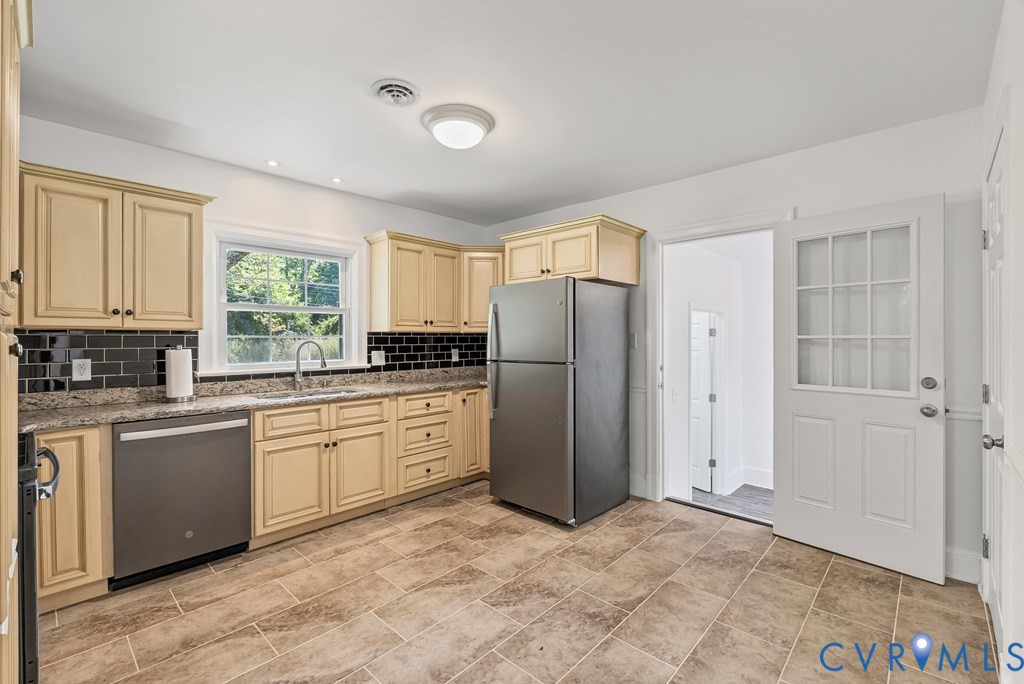 579 Stokes Road Farmville, VA 23901 - Photo 13 of 49 a kitchen with stainless steel appliances granite countertop a refrigerator and a stove top oven
