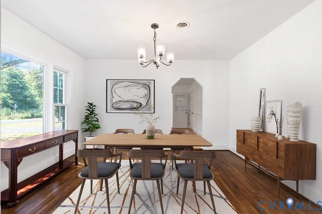 a view of a dining room with furniture window and wooden floor