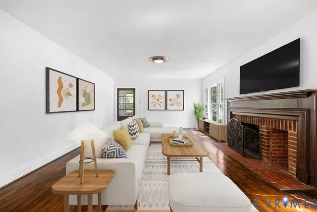 a living room with furniture and a fireplace