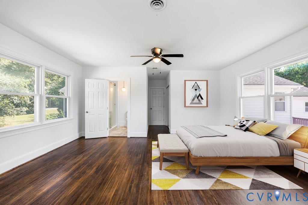 579 Stokes Road Farmville, VA 23901 - Photo 19 of 49 a bedroom with a bed and wooden floor