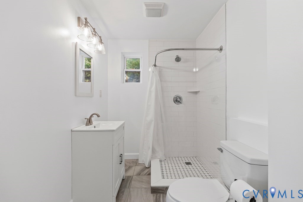 579 Stokes Road Farmville, VA 23901 - Photo 20 of 49 a bathroom with a toilet a sink and shower