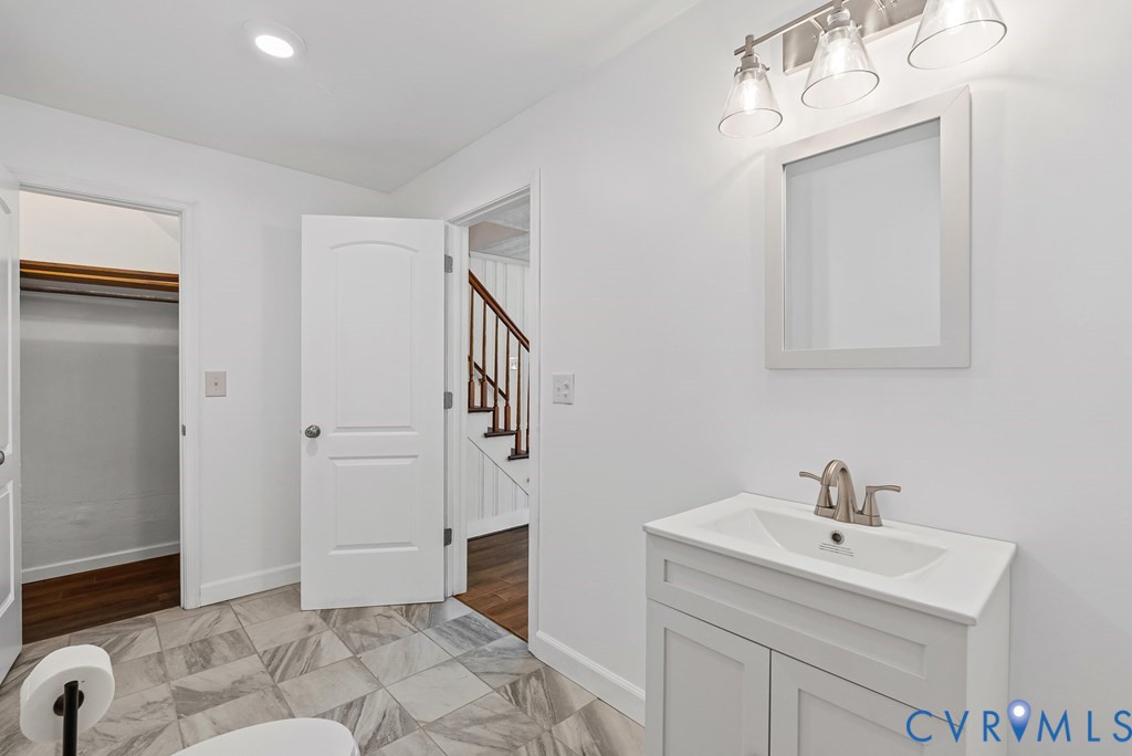579 Stokes Road Farmville, VA 23901 - Photo 21 of 49 a bathroom with a sink and a mirror