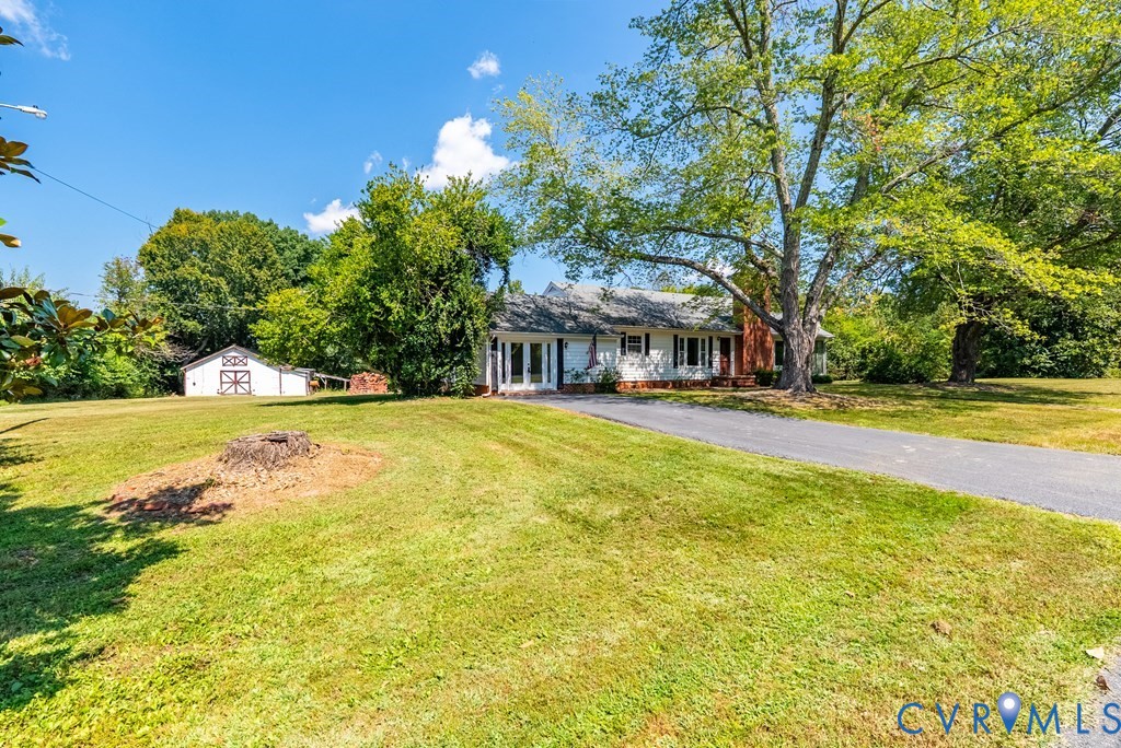 579 Stokes Road Farmville, VA 23901 - Photo 23 of 49 a house view with swimming pool and trees in the background