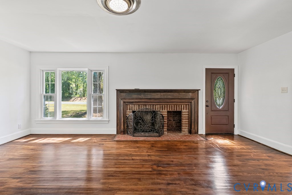 579 Stokes Road Farmville, VA 23901 - Photo 38 of 49 a view of an empty room with window and fireplace