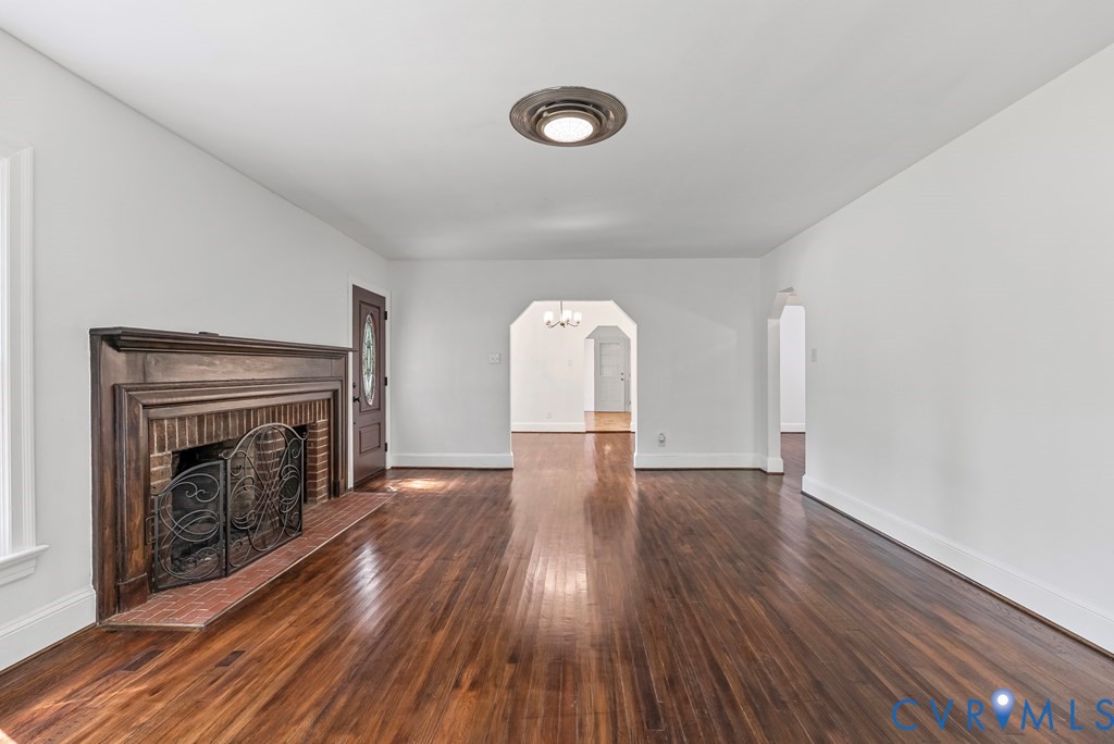 579 Stokes Road Farmville, VA 23901 - Photo 40 of 49 a view of empty room with wooden floor and fireplace