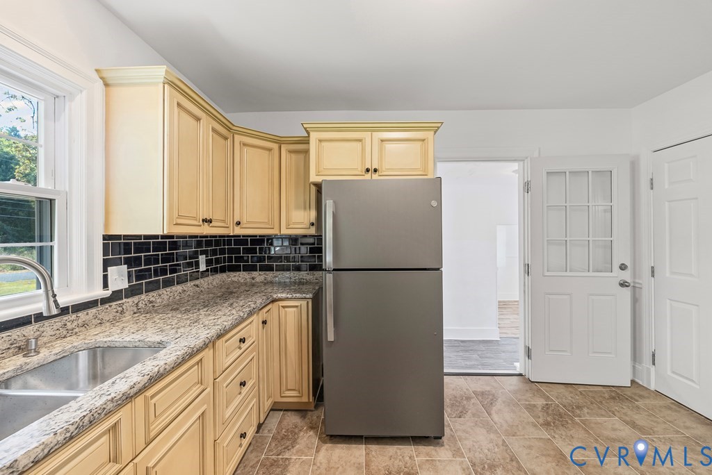 579 Stokes Road Farmville, VA 23901 - Photo 4 of 49 a kitchen with granite countertop a refrigerator sink and cabinets