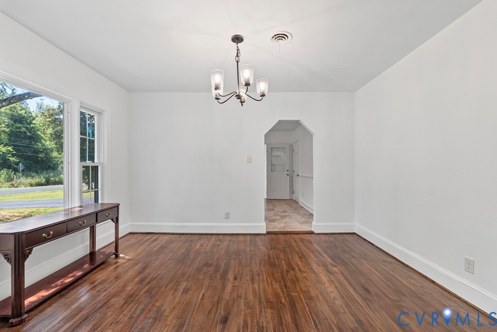 579 Stokes Road Farmville, VA 23901 - Photo 41 of 49 a view of empty room with wooden floor and fan