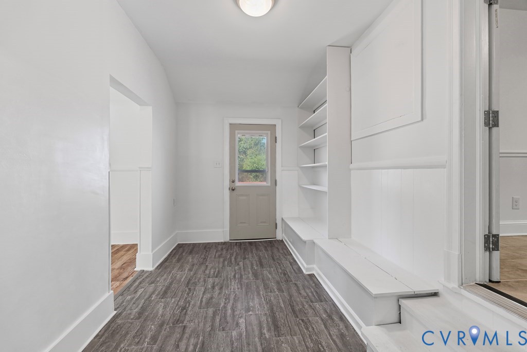 579 Stokes Road Farmville, VA 23901 - Photo 49 of 49 a view of hallway with a large window and wooden floor