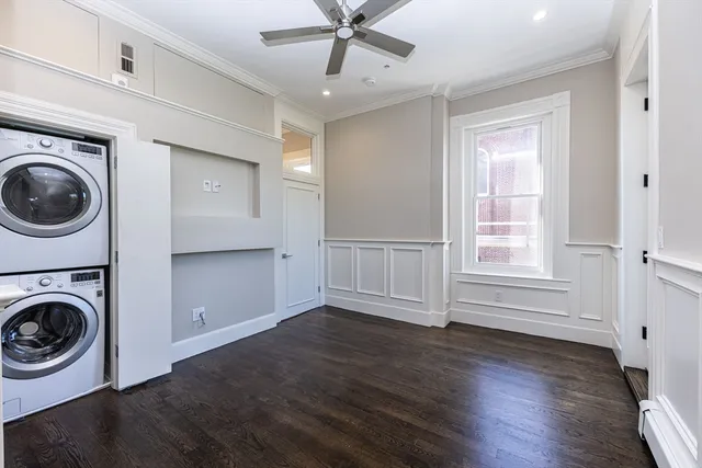 a view of a balcony with wooden floor and fence