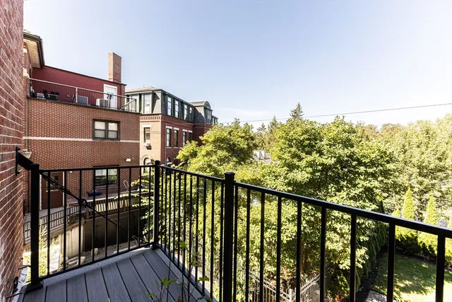 a view of a balcony with wooden floor