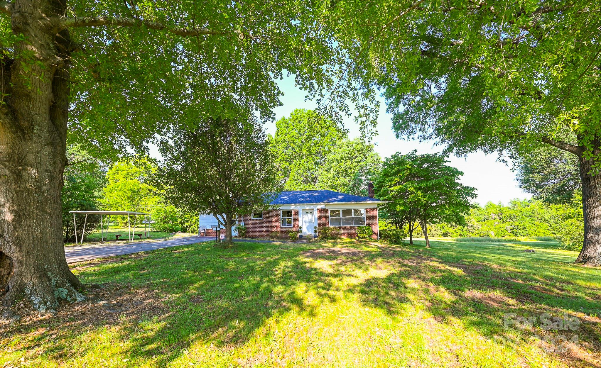 774 Poors Ford Road Rutherfordton, NC 28139 - Photo 1 of 25 a house view with swimming pool in front of it