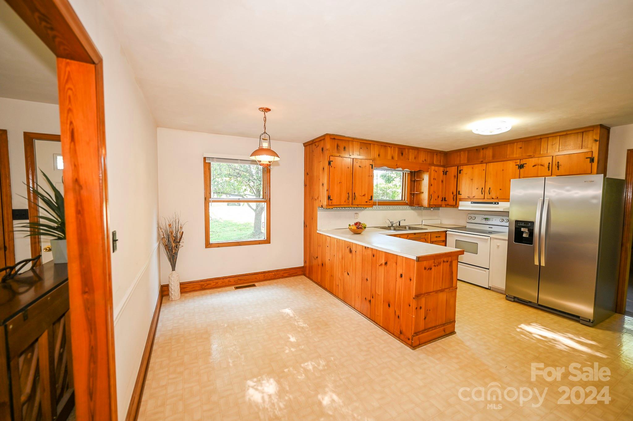 774 Poors Ford Road Rutherfordton, NC 28139 - Photo 13 of 25 a large kitchen with stainless steel appliances granite countertop a large counter top a stove and a refrigerator